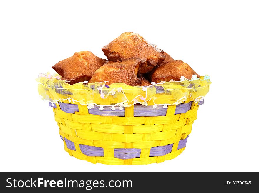 Basket with cupcakes on a white background