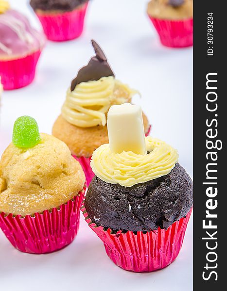 Assorted colorful and decorated cupcakes