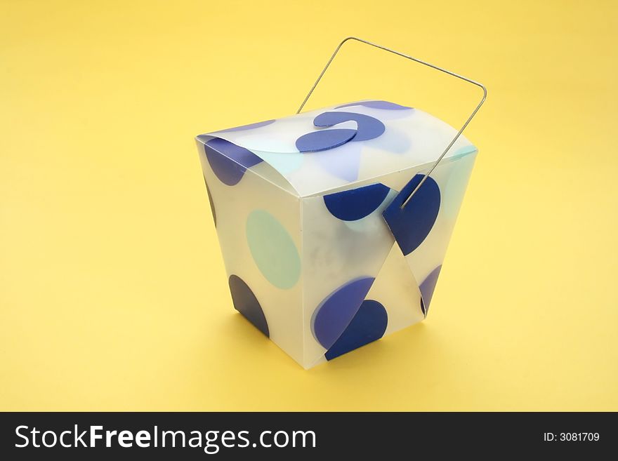 Blue dotted oriental carton isolated on yellow background. Blue dotted oriental carton isolated on yellow background