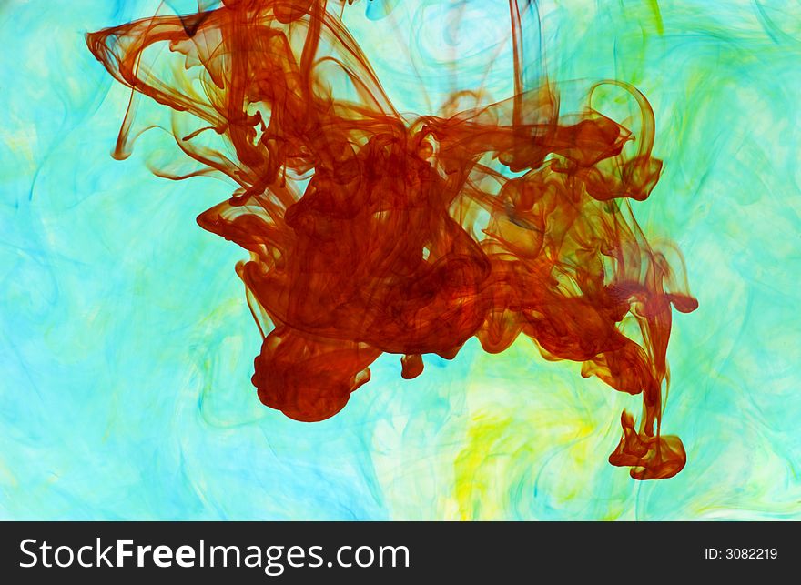 Abstract background of colorful dye drifting through water. Abstract background of colorful dye drifting through water
