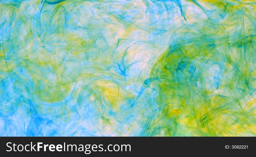 Abstract background of colorful dye drifting through water. Abstract background of colorful dye drifting through water