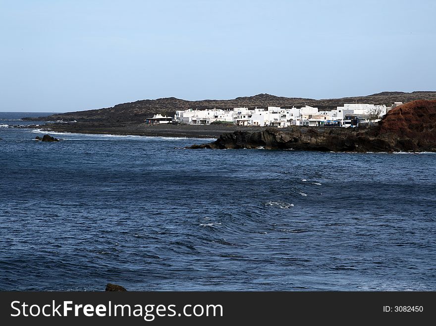 Fisherman village on a volcanic shore in canarias islands