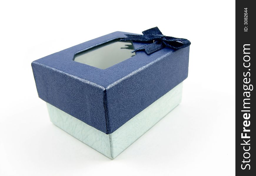 A beautiful small dark blue and light green gift box with see through lid.