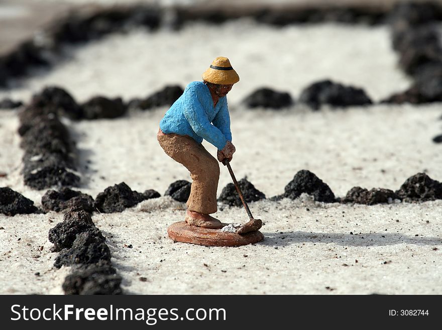 Small statue of a worker in a salt field