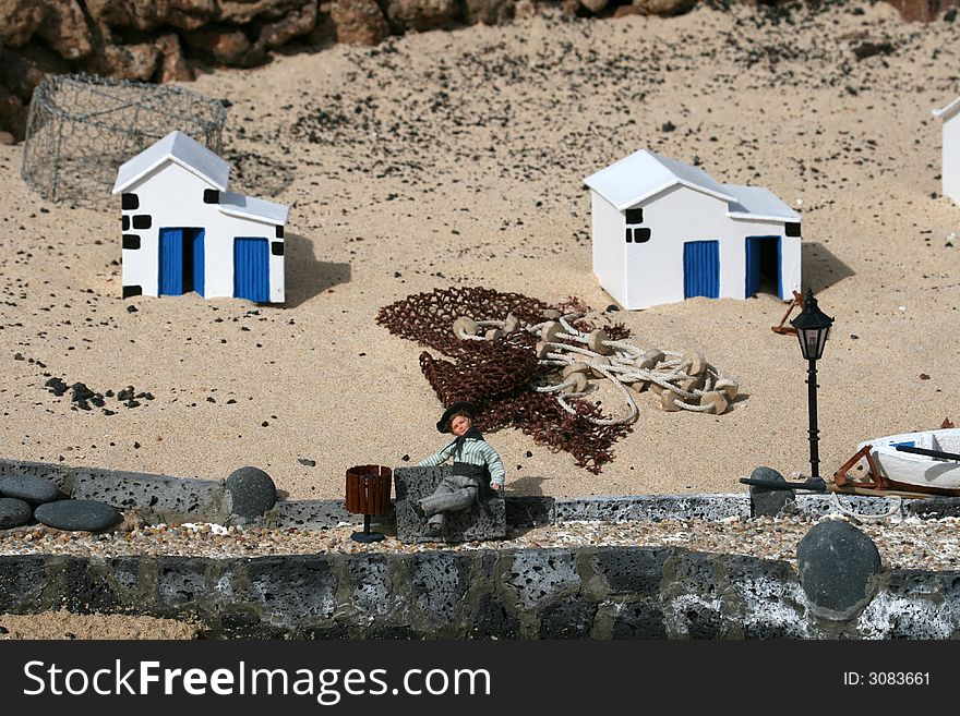 Miniature fisherman village scene with wooden boats