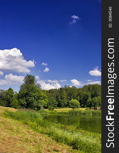 Landscape with blue sky, clouds, forest and lake. Landscape with blue sky, clouds, forest and lake
