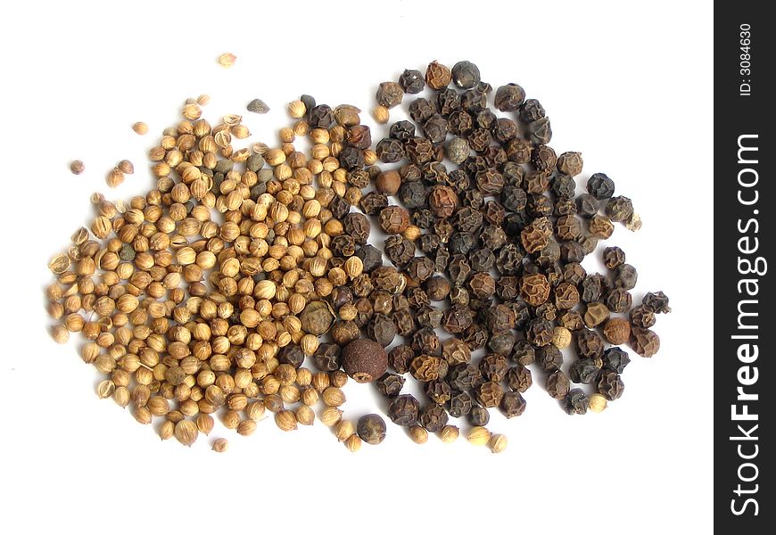 Spices - coriander and pepper - on white background. Spices - coriander and pepper - on white background
