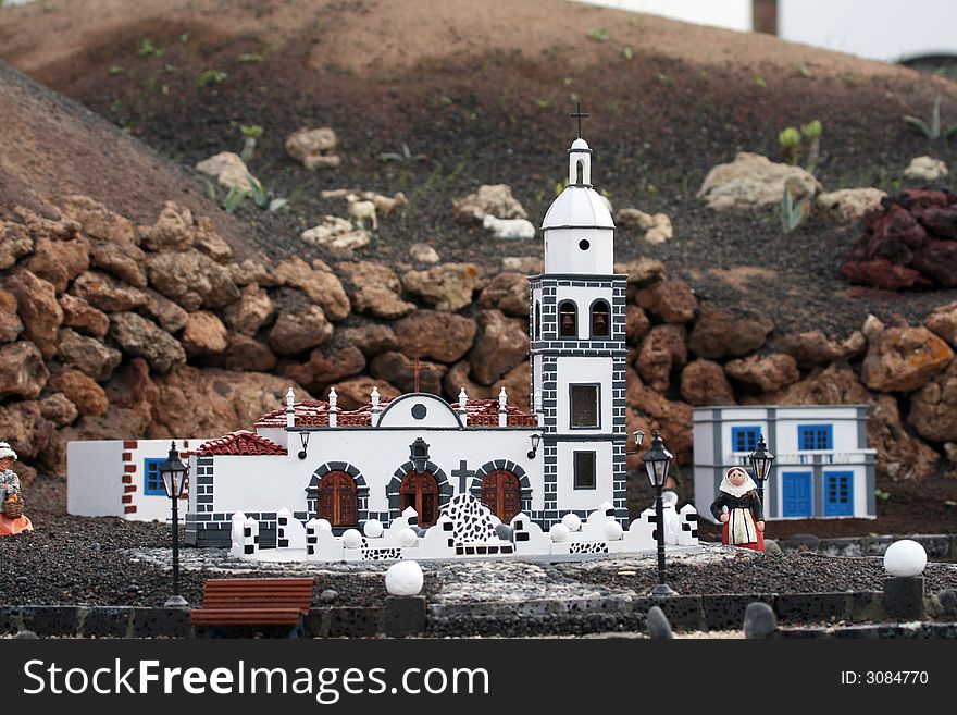 White church in a spanish village and a woman. White church in a spanish village and a woman