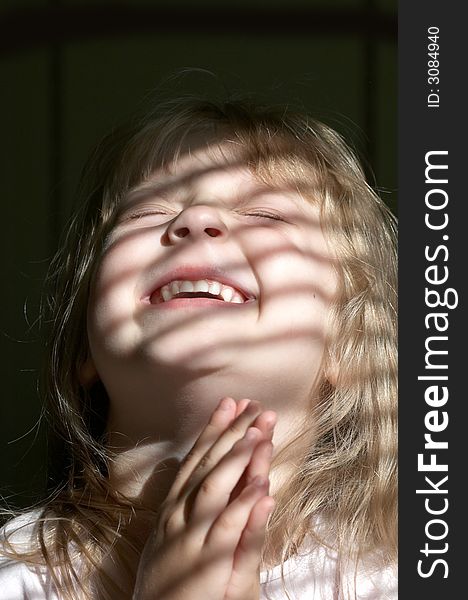 A portrait of girl in a striped light. A portrait of girl in a striped light