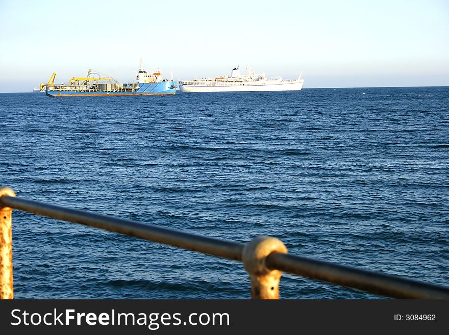 Old pier,two ship and a sea. Old pier,two ship and a sea.