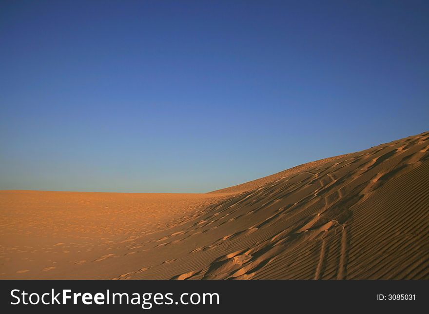 Foot Steps In A Desert