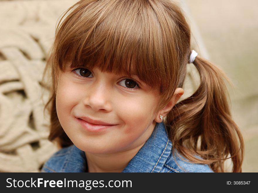 A portrait of a pretty young girl smiling. A portrait of a pretty young girl smiling