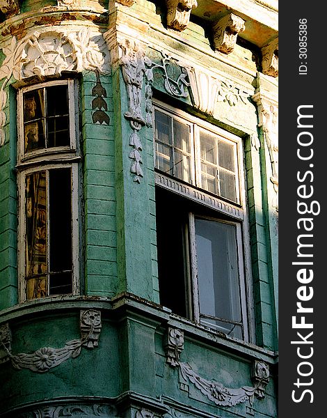 The corner and windows of an ancient masterpiece - the green house in barocco style. The corner and windows of an ancient masterpiece - the green house in barocco style