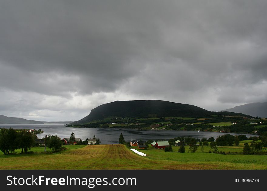 Rural norwegian landscape with mountains