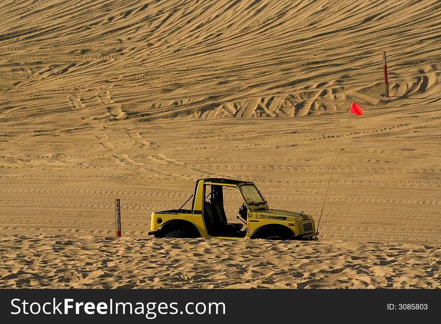 Single off road vehicle parked in the middle of desert. Single off road vehicle parked in the middle of desert