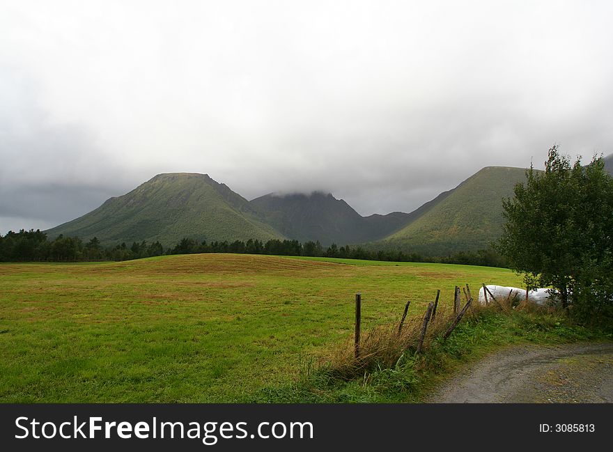 Rural norwegian landscape with mountains