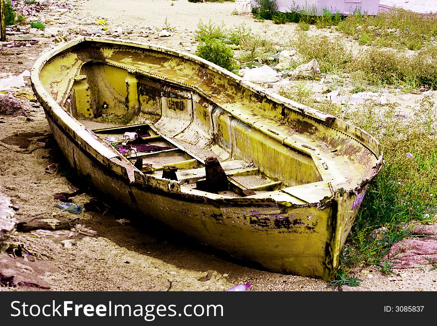 Old boat on old coast