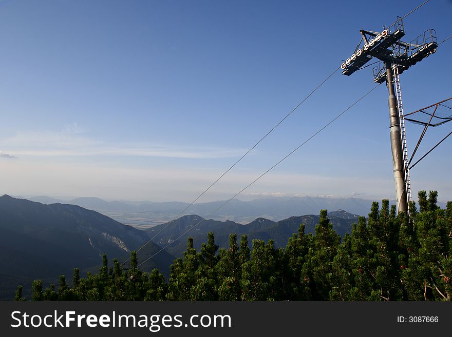 Big concrete chairlift pillar in mountains. Big concrete chairlift pillar in mountains