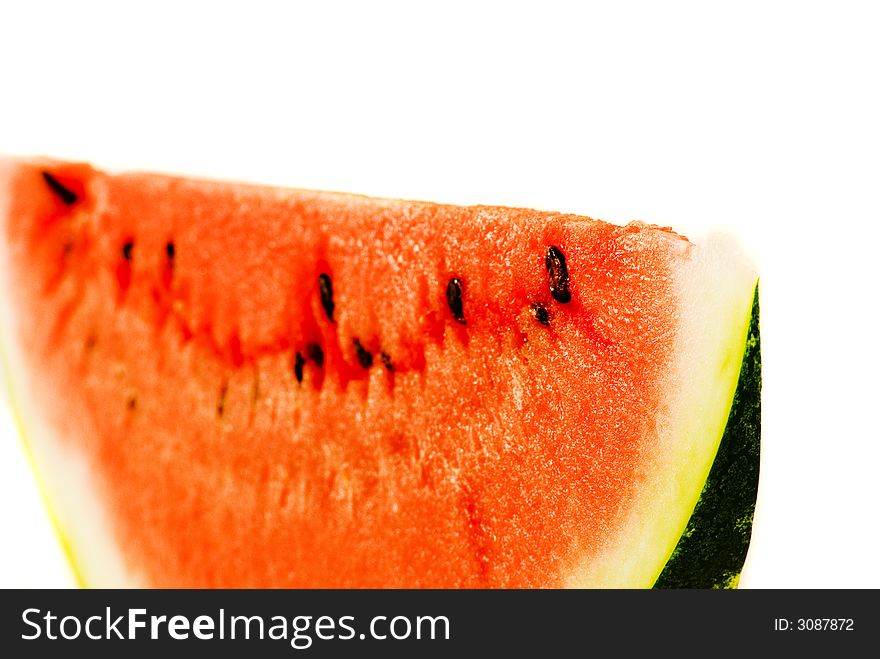 Slice of watermelon on the white background. Close-up shot. Slice of watermelon on the white background. Close-up shot.