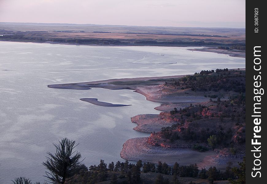 Glendo Reservoir as the sun is going down opposite this shore. Glendo Reservoir as the sun is going down opposite this shore.