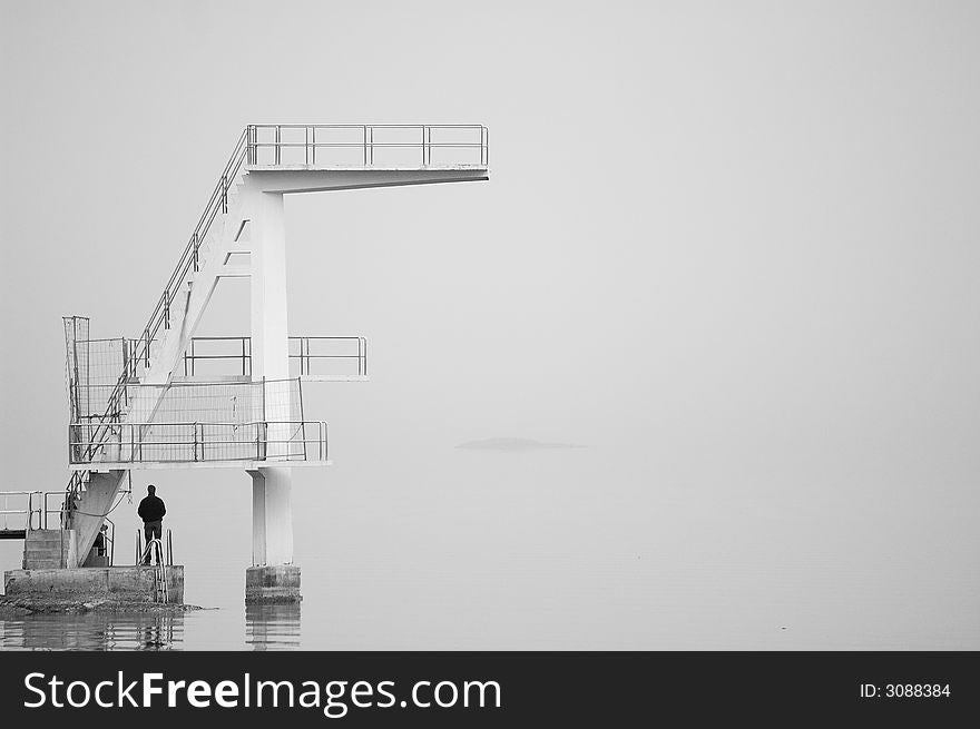 Dive tower in the fog.