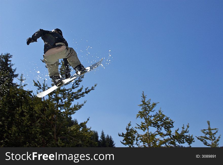 Almaty. Snowboarder jumping on the bigair in the Tien Shan