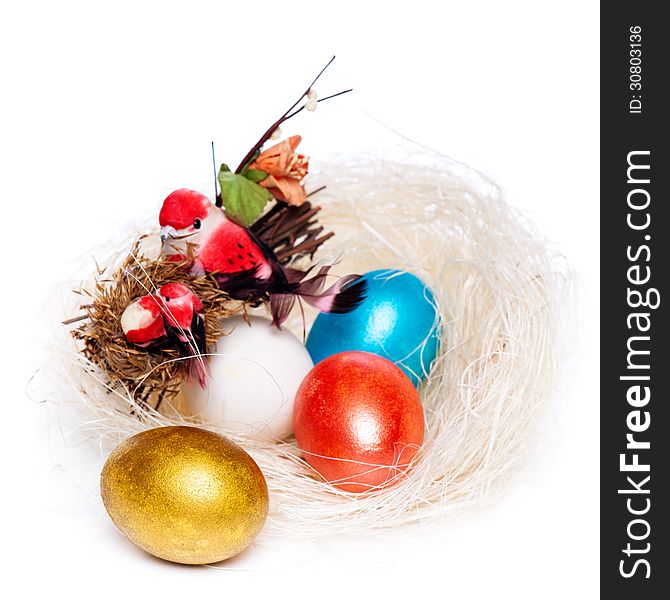 Colorful eggs in a wicker, over white background.