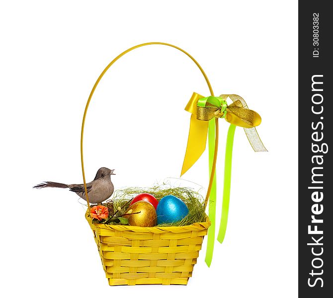 Colorful eggs in a wicker, over white background.