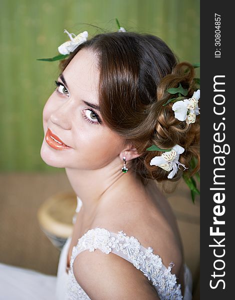 Portrait beautiful bride with flowers in hair. Portrait beautiful bride with flowers in hair