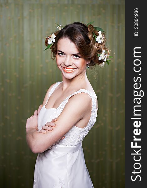 Portrait beautiful bride with flowers in hair. Portrait beautiful bride with flowers in hair
