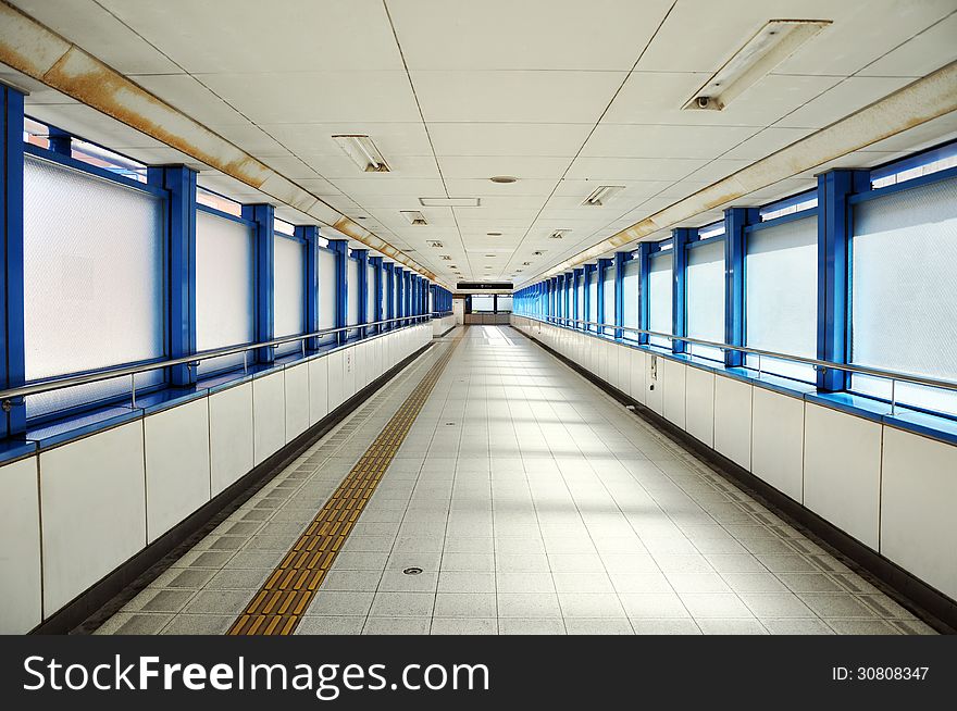 Empty long corridor in the modern office building.