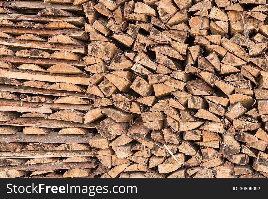 Firewood background. 1/3 far and 2/3 wide