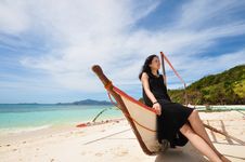 Happy Young Girl Sit On Boat On White Beach Stock Photos