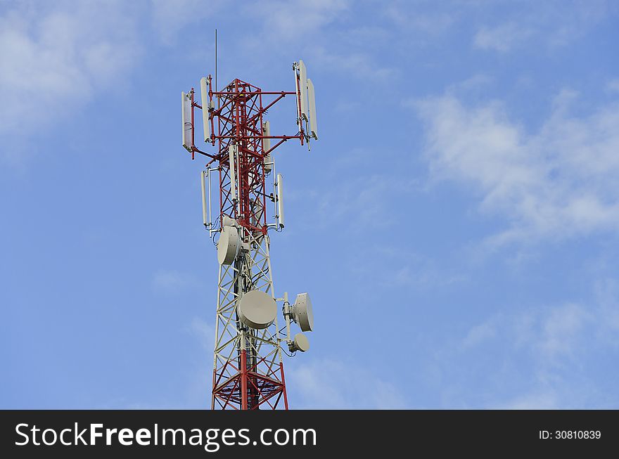 Telecommunication tower with antennas on a blue sky background. Telecommunication tower with antennas on a blue sky background