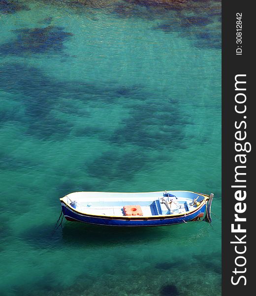 Small Recreational Boat On Shallow Lagoon
