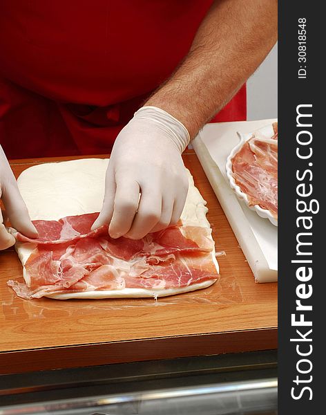 Hand preparing a sandwich