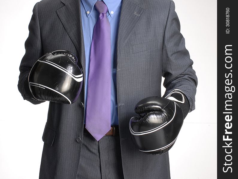 Businessman with a boxing gloves. Businessman with a boxing gloves
