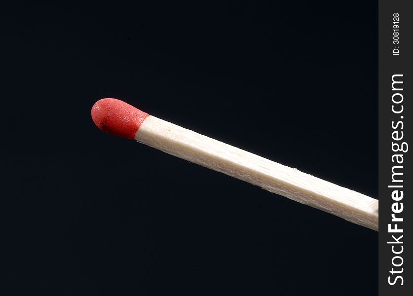 Wood match stick isolated on black background. Wood match stick isolated on black background.