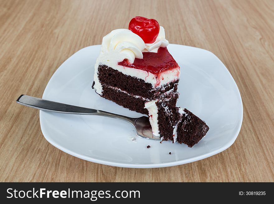 Chocolate cake and fresh cherry