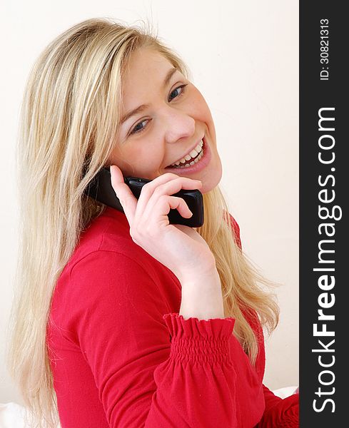 Young woman talking on the phone. Young woman talking on the phone