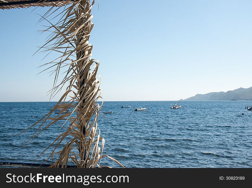 Post with the Mediterranean sea in the background