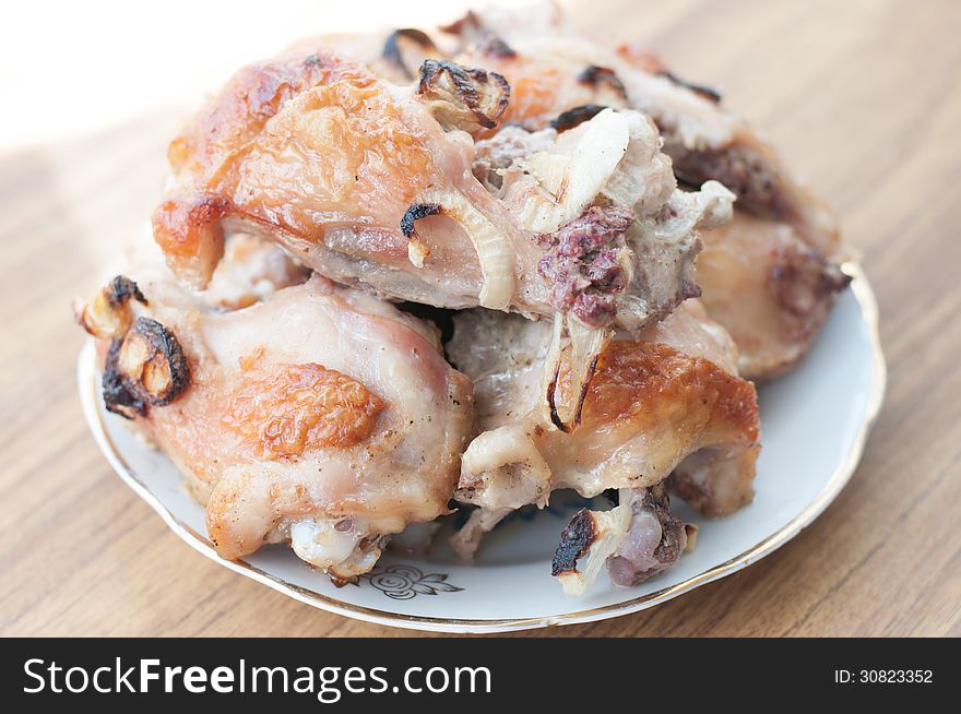 Grilled chicken legs on plate