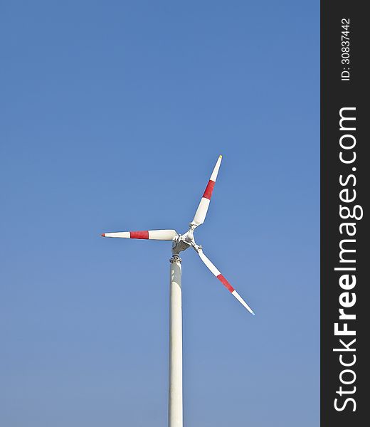 White weathervane and pole in space of blue sky. White weathervane and pole in space of blue sky