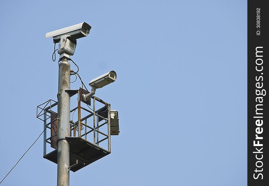 High tower of CCTV camera system in daytime