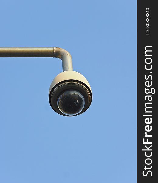 Remote controlled security camera in blue sky and sunny day