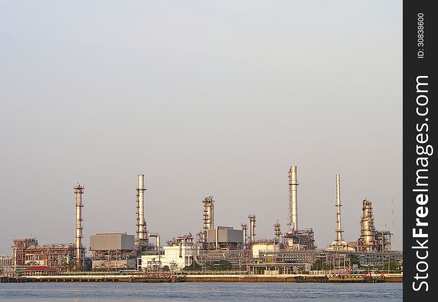 Group of refinery tower in cloudy day and sunlight. Group of refinery tower in cloudy day and sunlight