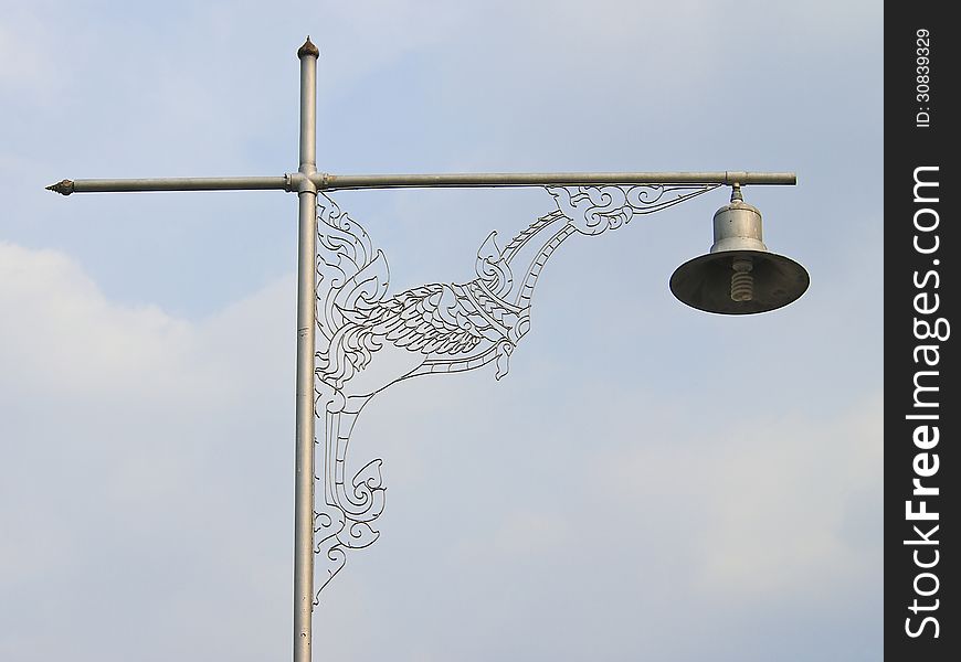 Thai art design of light pole in cloudy day. Thai art design of light pole in cloudy day