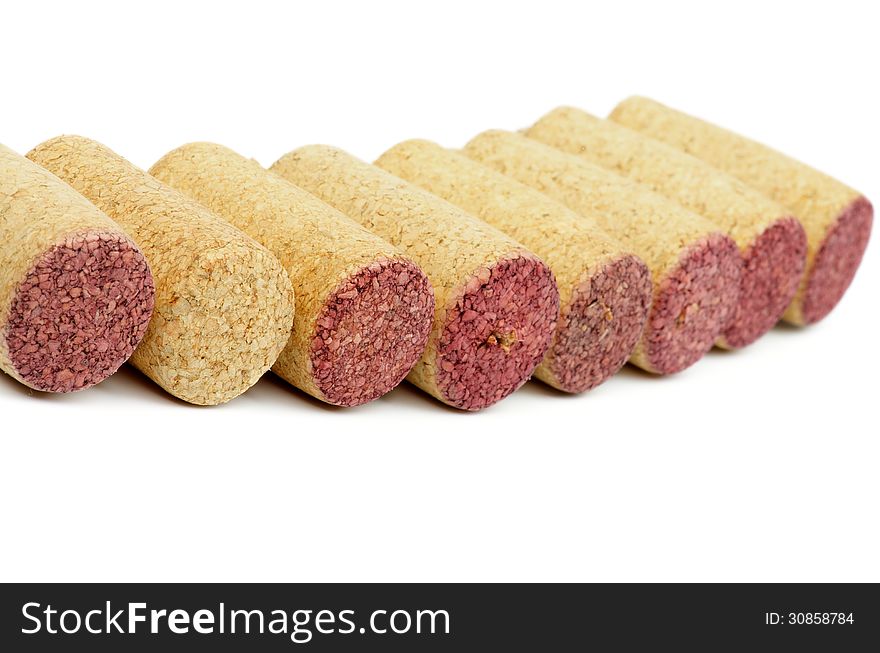 Old and New Wine Corks In a Row on white background