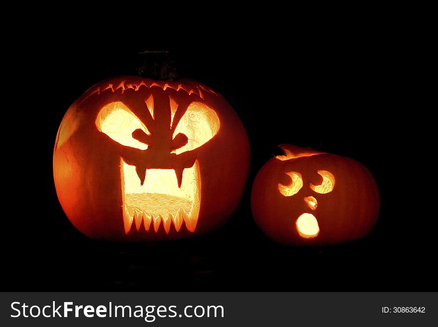 Two Jack-o-lantern's with humorous expressions. Two Jack-o-lantern's with humorous expressions.