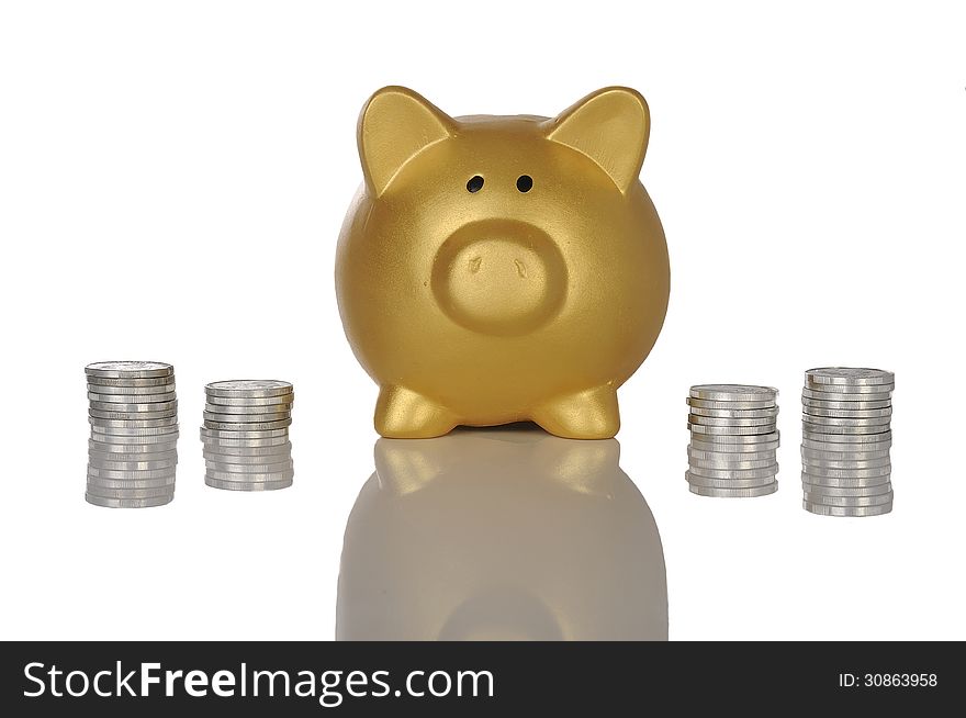 Golden piggy bank with stack of coins. Golden piggy bank with stack of coins